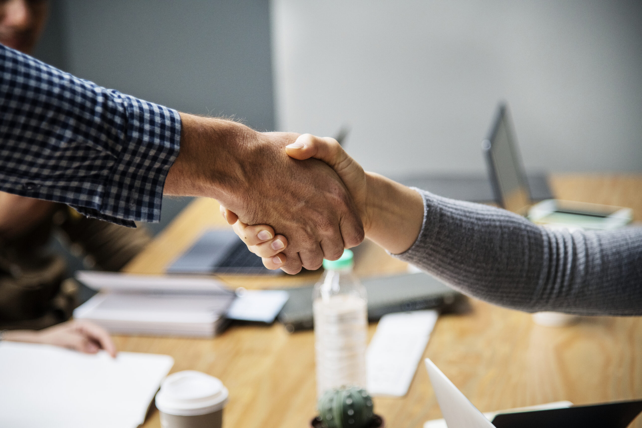 Business people shaking hands in agreement